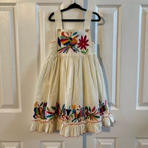 Nativa Girls Cream Color Sun Dress With Embroidered Animals & Ruffle Hemline